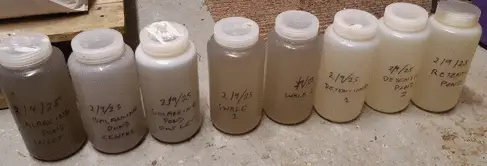 Wild Park rainscape water samples collected in plastic bottles.