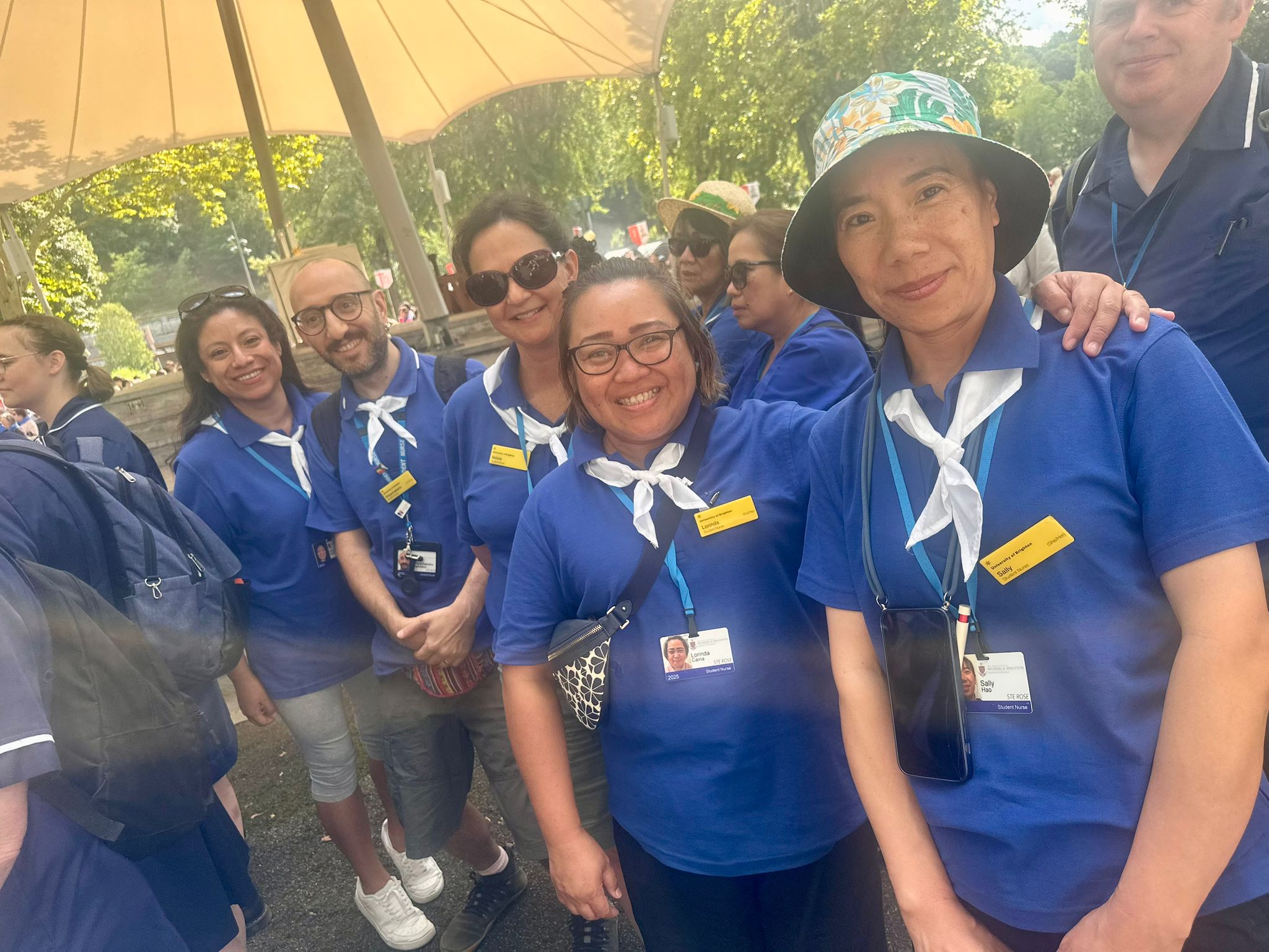 Nursing students wearing blue smile to have their picture taken