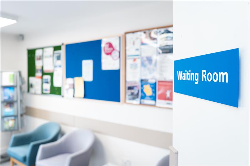 Shallow focus of a typical NHS hospital waiting room sign seen in a British hospital. - stock photo (Nickbeer)
