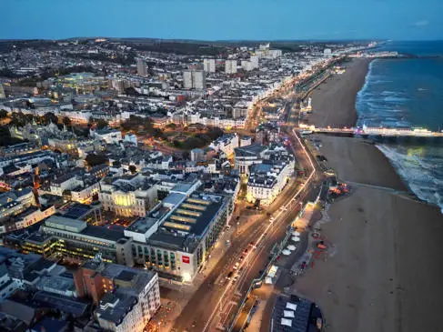 Aerial shot of Brighton city and beachfront at dusk