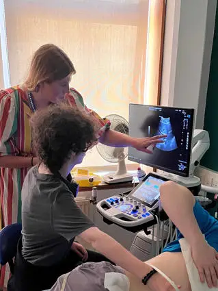 Charlene reviewing scan of body with student 