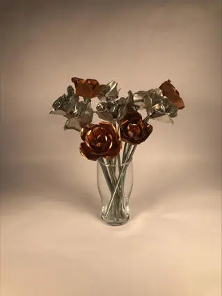 Metal flowers in a glass vase