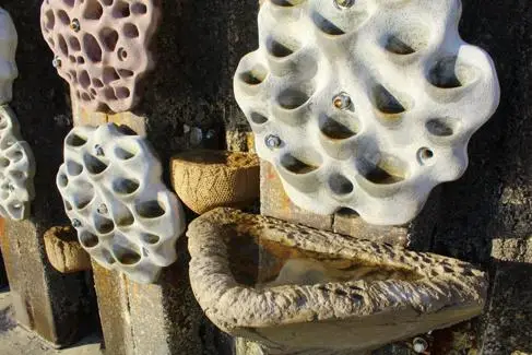 Close up of The living sea tiles on the harbour wall