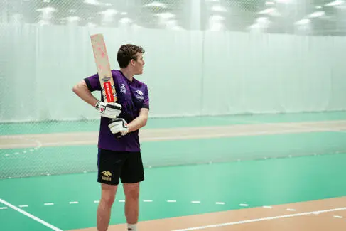 Cricketer holding bat