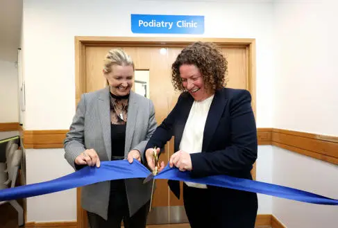 Donna Whitehead and Siobhan Melia cut the ribbon of the podiatry clinic
