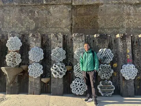 Isaac Doyle smiles against the living sea wall at Southwick beach