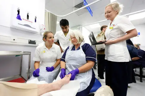 Podiatrists and UoB students in action at the podiatry clinic