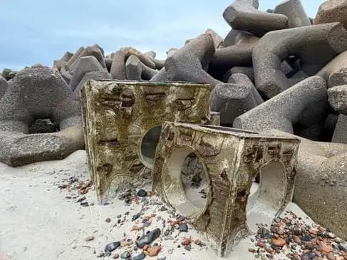 Reef cubes on Southwick beach landscape