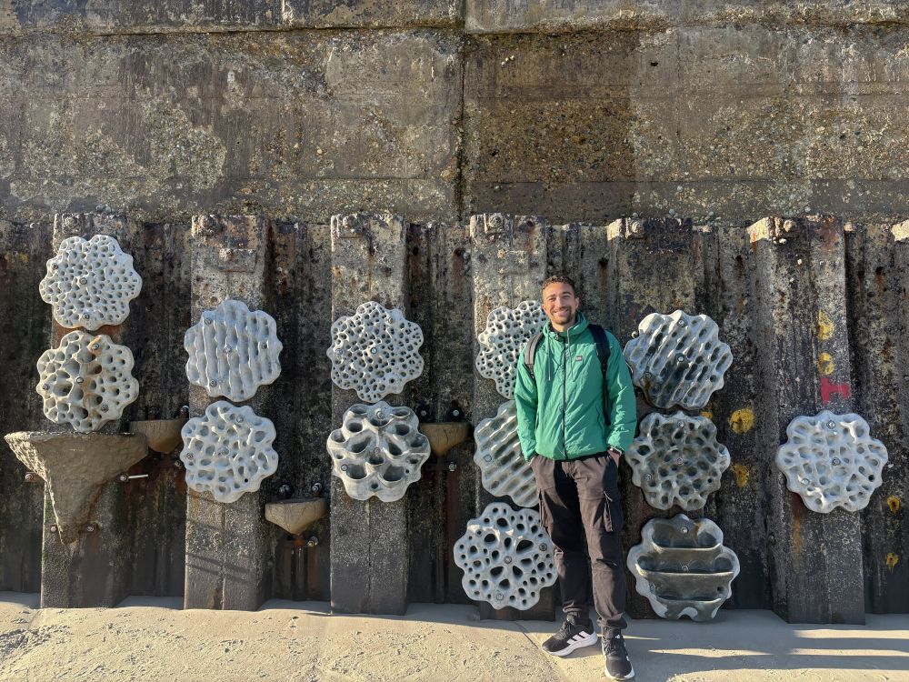 Isaac Doyle smiles against the living sea wall at Southwick beach