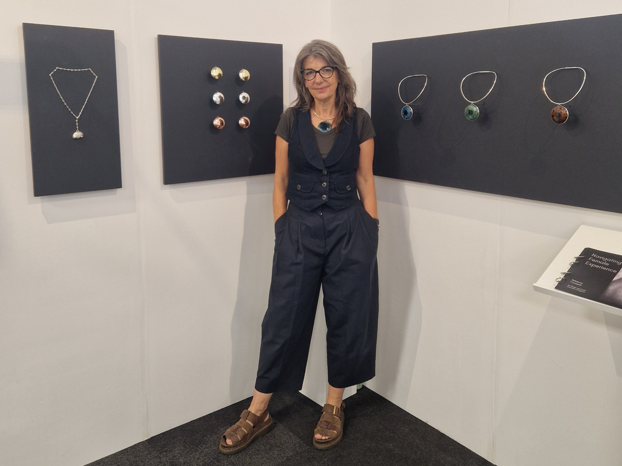 Rebecca Cormack poses next to her work