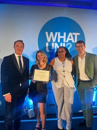 Members of BSU accepting the Bronze Award for Brighton Boost at the What Uni Awards