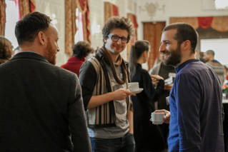 Staff from the University of Brighton network during coffee at the launch party for Centre for Arts and Wellbeing in the Old Ship, Brighton