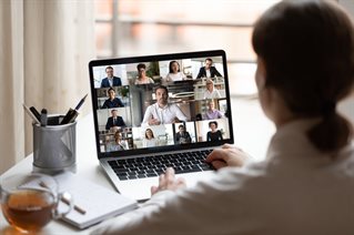 A student participating in an online class on a laptop
