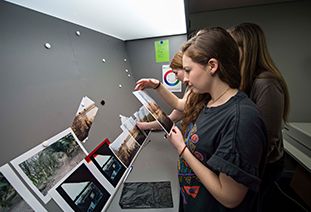Media students examining printed photos