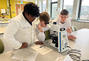 Secondary school students in a chemistry lab