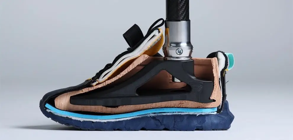 Side view of a prosthetic foot prototype showing layered materials, designed by Will Goddard