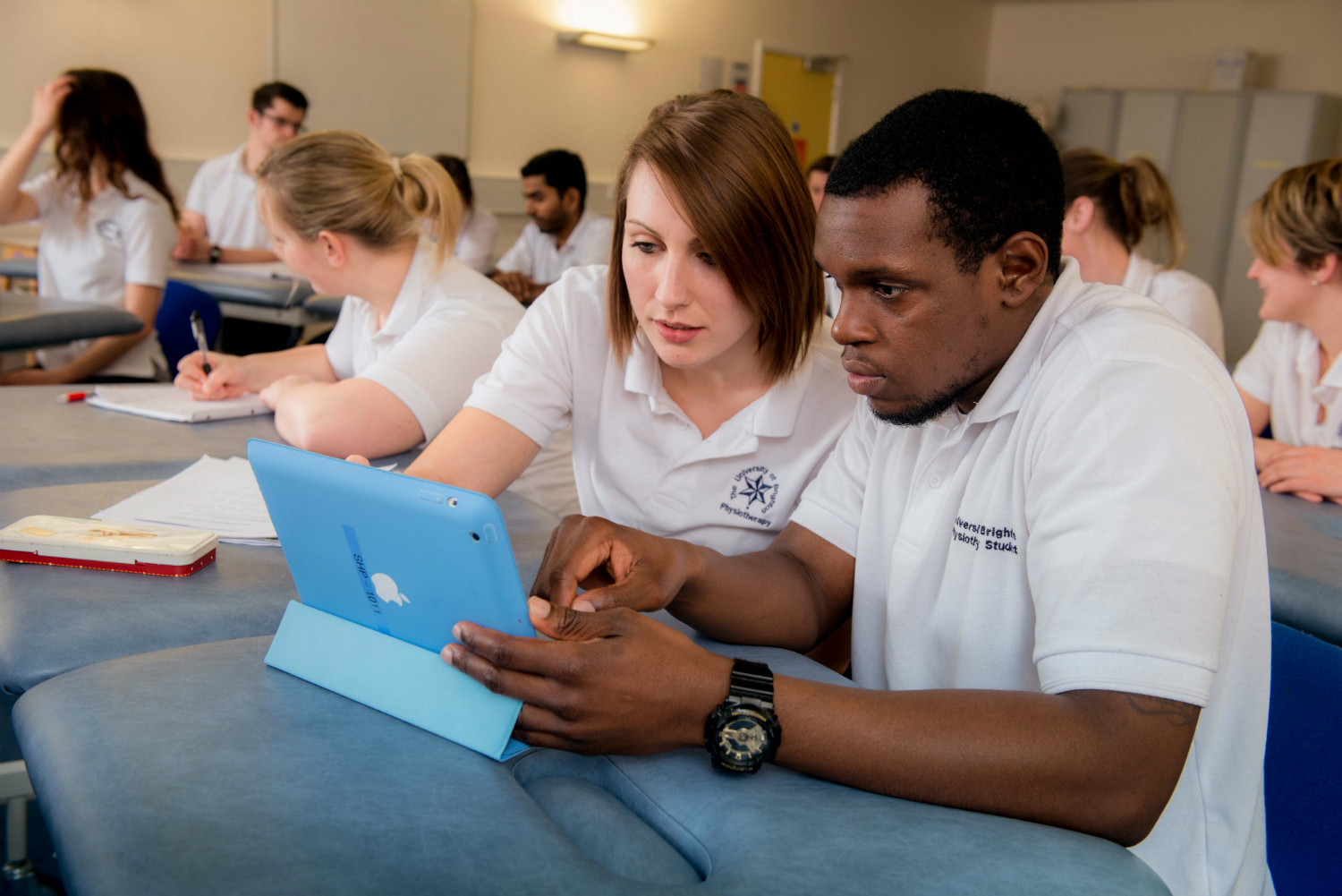 Two physiotherapy students using tablets
