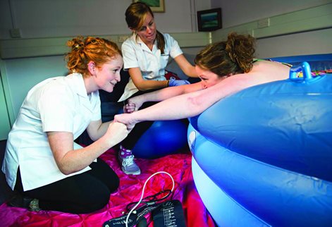 Midwifery students using the simulation suite