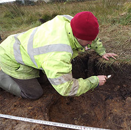 Dr Chris Carey taking a soil sample