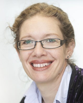 Head and shoulders portrait of Helen Johnson, Director of the research Centre for Arts and Wellbeing