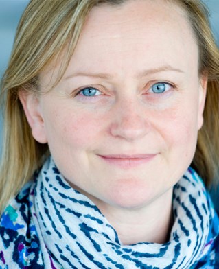 Head and shoulders portrait photograph of the Director of the research Centre for Digital Media Cultures, Dr Mary Darking