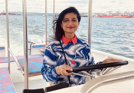 Zakkiya Khan on a speedboat on the water