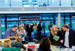 People in the foyer of a university building