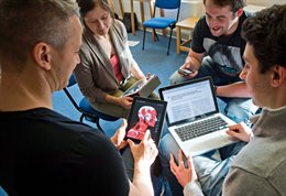 Students with various digital devices