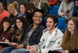 Students in lecture hall laughing