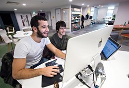 Two students working at computers