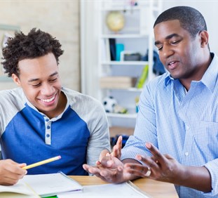 Father helping son with application