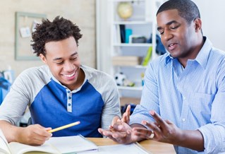 Father helping son with application