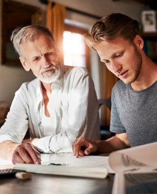 Father helping son with studies