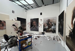 Art studio with large paintings on the walls