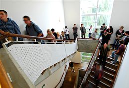 Students queueing on an internal stairwell
