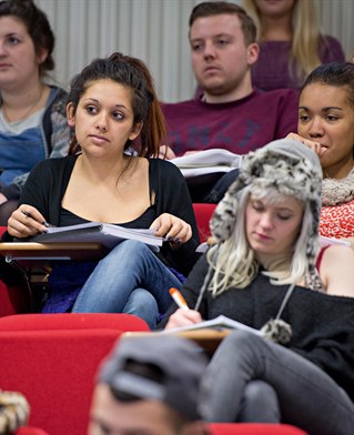 Students at desks in a seminar